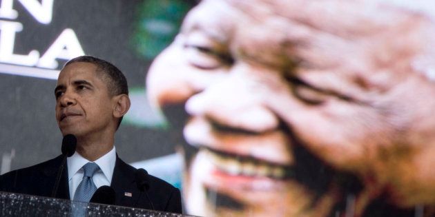 Then US President Barack Obama speaking during the memorial service for late South African President Nelson Mandela at Soccer City Stadium in Johannesburg on December 10, 2013.