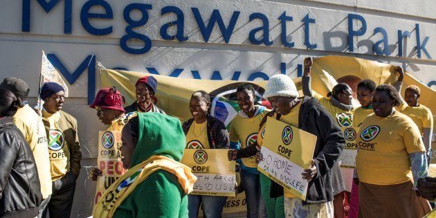 Members of South African political party Congress of the People (Cope) demonstrate outside state entity Eskom Offices at Megawatt Park.