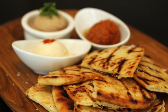 BOSTON - NOVEMBER 25: Warm Naan Bread with Three Spreads - $12 - tuscan white bean, honey whipped ricotta and toasted walnut muhamara. Dishes at Stephi's in Southie are photographed, on Monday, November 25, 2013. (Photo by Pat Greenhouse/The Boston Globe via Getty Images)