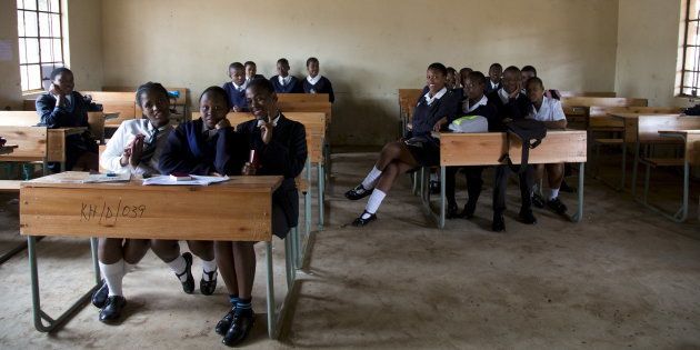 A 12th grade class at Khabazela High School pose for a picture in their classroom in eMbo, west of Durban, South Africa, September 23, 2015.