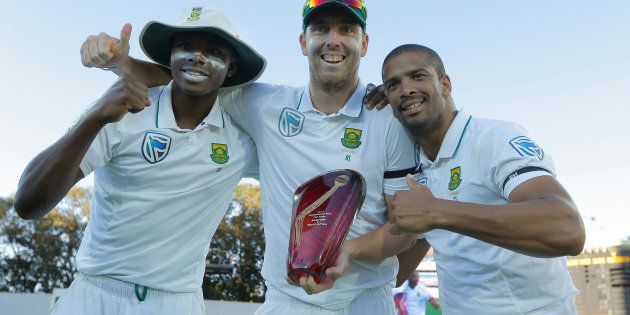 South African bowlers (L-R) Kagiso Rabada, Kyle Abbott and Vernon Philander pose with the test series trophy against Australia at the end of the fourth day of the Third Test cricket match in Adelaide in November 2016.
