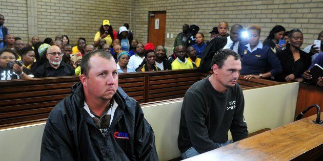 Theo Jackson and Willem Oosthuizen during their appearance at the Middelburg Magistrates Court for allegedly assaulting and forcing a farm worker, Rethabile Victor Mlotshwa into a coffin on November 16, 2016 in Mpumalanga, South Africa. There has been an uproar after a viral video showing Jackson and Oosthuizen assaulting and forcing Mlotshwa into a coffin. The two accused abandoned their bail applications sighting security concerns. The case was postponed to January 25, 2016.