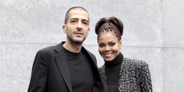 U.S. singer Janet Jackson (R) and her then boyfriend Wissam Al Mana pose for photographers as they arrive to attend the Giorgio Armani Autumn/Winter 2013 collection at Milan Fashion Week, February 25, 2013.