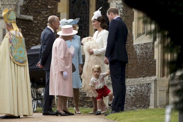 Britain's Queen Elizabeth is seen standing with her husband Prince Philip, Camilla, Duchess of Cornwall, Catherine, Duchess of Cambridge, Princess Charlotte, Prince George and Prince William after the christening of Princess Charlotte at the Church of St. Mary Magdalene in Sandringham, Britain July 5, 2015.