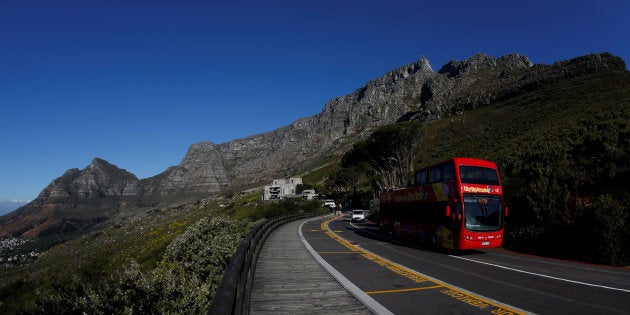 A tour bus carries visitors to Table Mountain in Cape Town, South Africa, August 5, 2017. REUTERS/Mike Hutchings