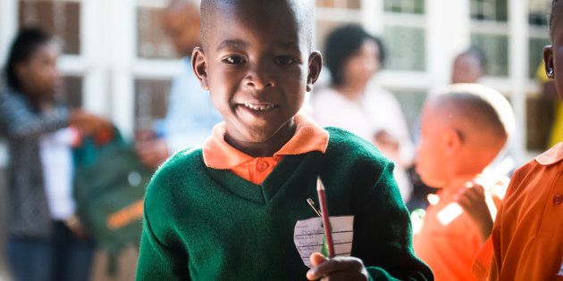 A grade 1 learner of Oost-Eind Primary School shows his stationery on his first day at school on January 11, 2017 in Pretoria, South Africa. Millions of pupils flocked back to schools as the 2017 school year commences in South Africa.