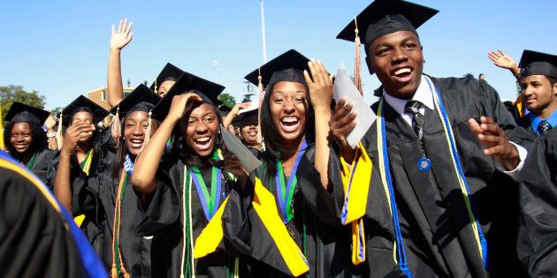 Students react during the graduation ceremony of the 2010 class at Hampton University in Virginia May 9, 2010. U.S.