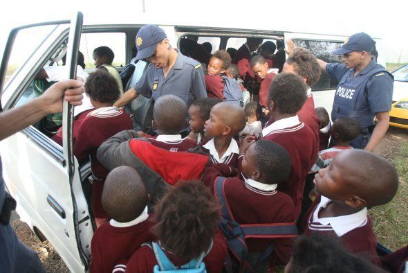 48 pupils get out of a minibus-taxi after police at Kabega Park pulled the taxi over to fine the driver for heavily overloading the vehicle.