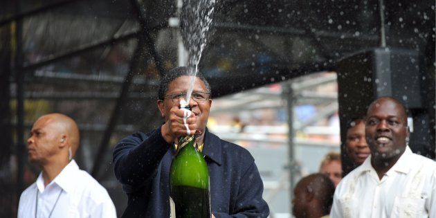 Sports and Recreation minister Fikile Mbalula opens a bottle of chmpagne to toast at the ANC's 99th birthday party held at the Peter Mokaba Stadium in Polokwane, South Africa on 8 January 2011.