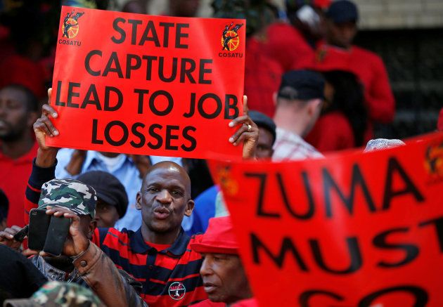 Protesters attend a demonstration organised by The Congress of South African Trade Unions (Cosatu).