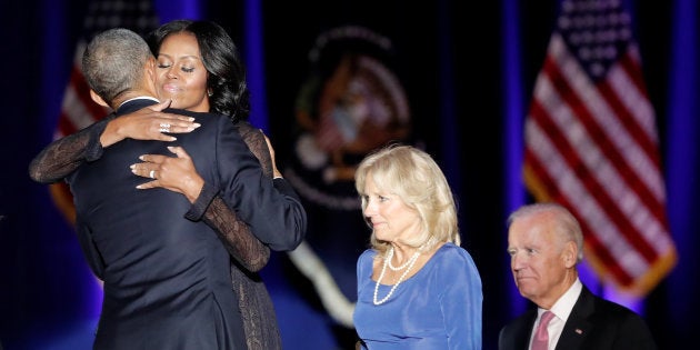 U.S. President Barack Obama hugs his wife Michelle as Vice-President Joe Biden and his wife Jill look on after the President delivered a farewell address at McCormick Place in Chicago, Illinois, U.S. January 10, 2017. REUTERS/John Gress