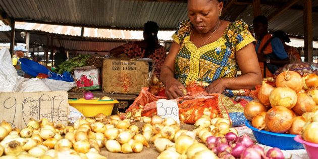 A vendor arranges onions and vegetables at her grocery stall at the Sigida Market, within Kinshasa Municipality, in Kinshasa, Democratic Republic of Congo, October 3, 2017. REUTERS/Robert Carrubba