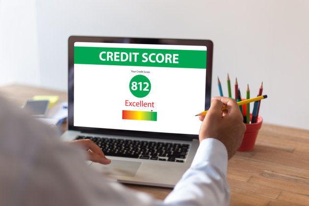 Businessman Checking Credit Score on Internet