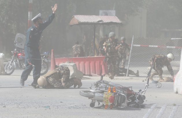 Afghan security forces are seen at the site of a second blast in Kabul, Afghanistan April 30, 2018. REUTERS/Omar Sobhani