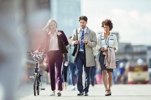 Business people walking and talking in city