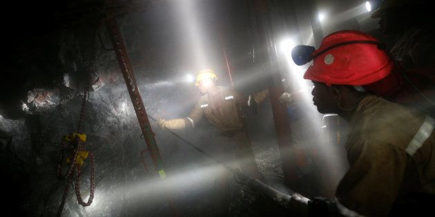 Mine workers employed at Sibanye Gold's Masimthembe shaft operate a drill in Westonaria, South Africa, April 3, 2017. Picture taken April 3, 2017.