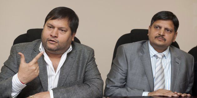 Indian businessmen, Ajay Gupta (R) and younger brother Atul Gupta.