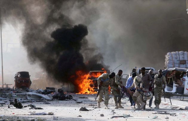 Somali Armed Forces evacuate their injured colleague, from the scene of an explosion in KM4 street in the Hodan district of Mogadishu, Somalia October 14, 2017.