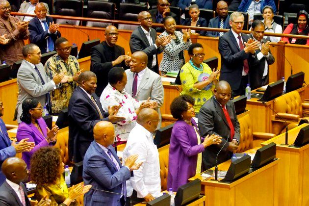 Members of Parliament and National Assembly speaker Baleka Mbete applaud Cyril Ramaphosa prior to his swearing in as South Africa's president. February 15 2018.
