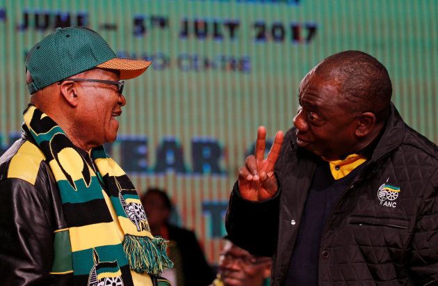Former President Jacob Zuma (L) chats to President Cyril Ramaphosa at the ANC national policy conferenc. June 30 2017.