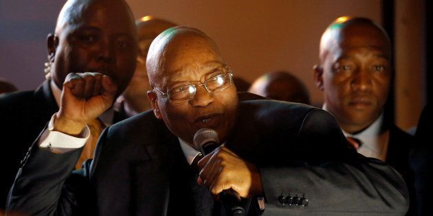 President Jacob Zuma celebrates with his supporters after he survived a no-confidence motion in parliament vote in Cape Town, South Africa, August 8, 2017.