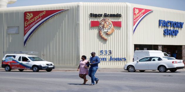 A couple leaves Tiger Brands factory shop in Germiston, Johannesburg, South Africa, March 5, 2018. REUTERS/Siphiwe Sibeko