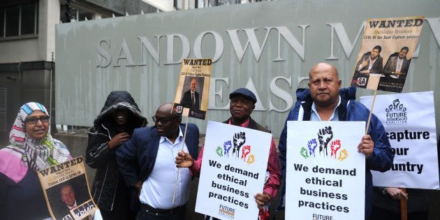 SANDTON, SOUTH AFRICA OCTOBER 05: (SOUTH AFRICA OUT): Future SA supporters picket outside the McKinsey offices on October 05, 2017 in Sandton, South Africa. The civil society group protested against the way in which the global company conducted itself in relation to its empowerment partner Trillian Capital and their business deals with Eskom. (Photo by Felix Dlangamandla/Foto24/Gallo Images/Getty Images)