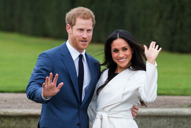 LONDON, ENGLAND - NOVEMBER 27: Prince Harry and Meghan Markle, wearing a white belted coat by Canadian brand Line The Label, attend a photocall in the Sunken Gardens at Kensington Palace following the announcement of their engagement on November 27, 2017 in London, England. (Photo by Anwar Hussein/Getty Images) *** Local Caption *** Prince Harry;Meghan Markle