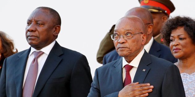 Deputy President Cyril Ramaphosa (L) and President Jacob Zuma listen to the national anthem at the opening of Parliament in Cape Town, February 11, 2016.