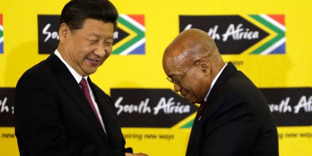 South African President Jacob Zuma, right, shakes hand with Chinese President Xi Jinping, left, after their joint media conference at Union Building Pretoria, South Africa, Wednesday, Dec. 2, 2015.