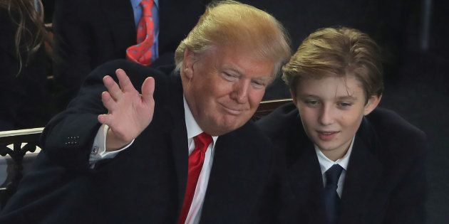U.S. President Donald Trump and his son Barron attend the Inaugural Parade in Washington, January 20, 2017.