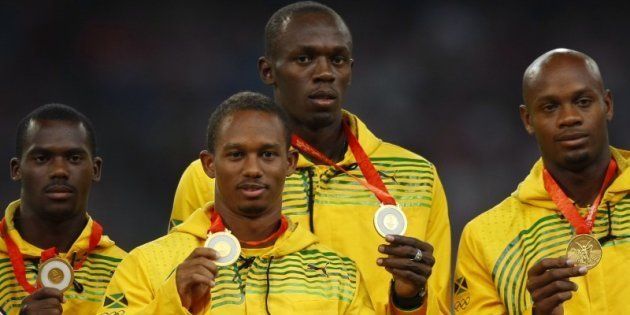 Gold medalists (L - R) Nesta Carter, Michael Frater, Usain Bolt, Asafa Powell of Jamaica during the medal ceremony for the men's 4 x 100m relay final of the athletics competition in the National Stadium at the Beijing 2008 Olympic Games on August 23, 2008.