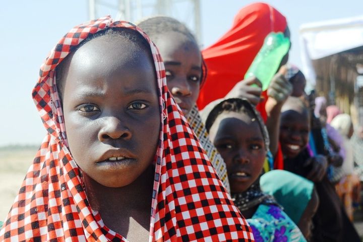 Girls line up in preparation for the first day of school in a refugee camp in Maiduguri, Nigeria, Jan 18, 2017. Thomson Reuters Foundation/Kieran Guilbert