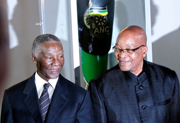 South Africa's President Jacob Zuma (R) pose with former president Thabo Mbeki during the lighting up ceremony of the centenary torch ahead of the upcoming African National Congress (ANC) centenary celebration in Bloemfontein January 8, 2012.