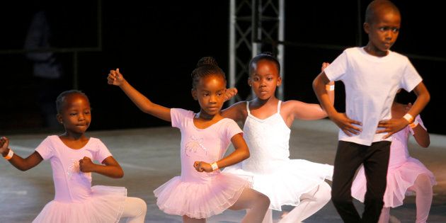 Young ballerinas perform a dance on stage in Alexandra Township north of Johannesburg, Saturday, Nov 17, 2012.