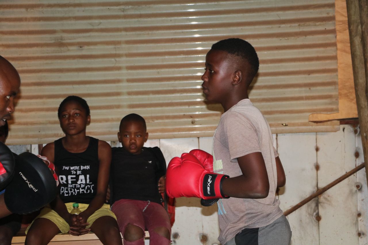 Nkosi Phendule teaches boxing to youngsters in Zandspruit, helping them avoid the many social ills around them.