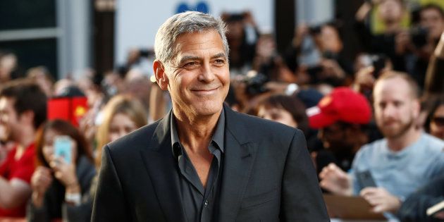 Actor George Clooney arrives on the red carpet for the film