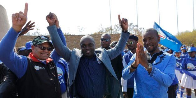 Solly Msimanga, centre, the mayor of Tshwane, with Democratic Alliance national leader, Mmusi Maimane, right, celebrate winning the city in 2016.