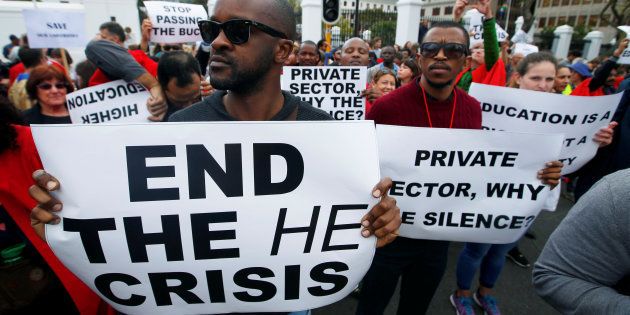 University students and staff protest against fee increases at tertiary educational institutions outside Parliament in Cape Town, South Africa September 22, 2016. REUTERS/Mike Hutchings