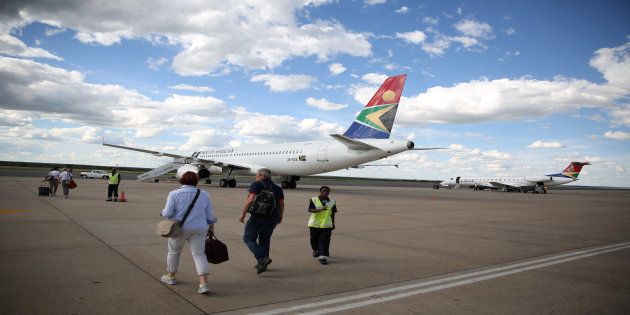 Passengers board a South African Airways the capital aircraft t the Hosea Kutako International Airport, outside Windhoek in Namibia, February 24, 2017.