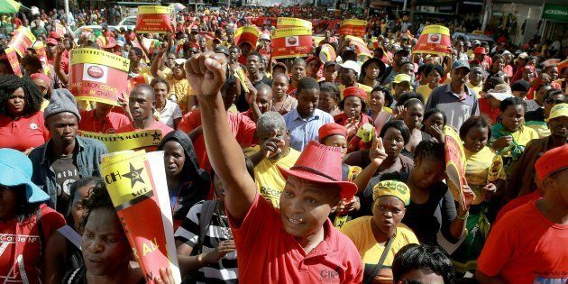Thousands of members of Congress of South African Trade Unions (COSATU) and South African Communist Party (SACP) attend a joint 'Peoples March' in the streets of Durban city centre on April 23, 2016.