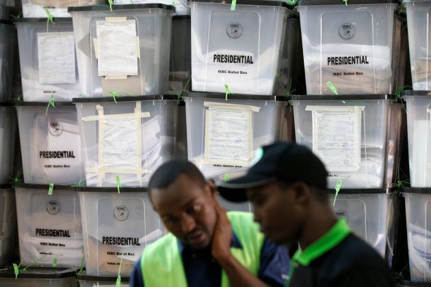 Independent Electoral and Boundaries Commission (IEBC) officials talk near stacked ballot boxes at a tally centre in Nairobi, Kenya October 27, 2017. REUTERS/Siegfried Modola