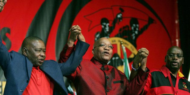HAPPIER DAYS: President Jacob Zuma (C) holds hands with Blade Nzimande (L) and Sdumo Dlamini (R) at the opening of the 10th Congress of South African Trade Unions (Cosatu) in Johannesburg on September 21, 2009.