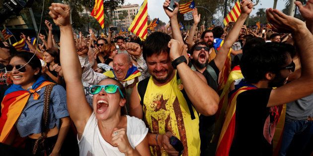 People celebrate after the Catalan regional parliament declares the independence from Spain in Barcelona, Spain, October 27, 2017. REUTERS/Juan Medina