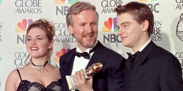 Director James Cameron (C) and actors Kate Winslet (L) and Leonardo DiCaprio(R) pose for photographers after Cameron won the award for Best Director for 'Titanic' at the 55th Annual Golden Globe Awards at the Beverly Hilton 18 January in Beverly Hills.