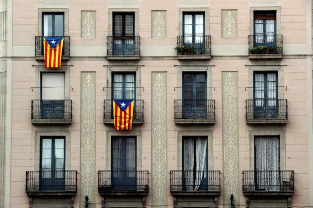 Catalan flags hang from balconies the morning after the Catalan regional parliament declared independence from Spain in Barcelona, Spain, October 28, 2017. REUTERS/Yves Herman