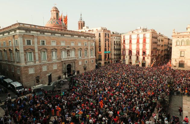 People gather in Sant Jaume square in front of the Catalan regional government headquarters after the regional parliament declared independence from Spain in Barcelona, Spain, October 27, 2017. REUTERS/Juan Medina