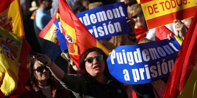 Pro-unity demonstrators with banners calling for the imprisonment of sacked Catalan President Carles Puigdemont, gather in Madrid, Spain, October 28, 2017. REUTERS/Susana Vera