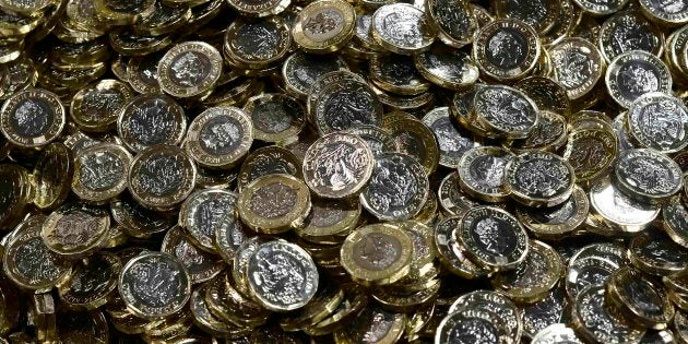 New one pound coins are seen at The Royal Mint, in Llantrisant, Wales, Britain.