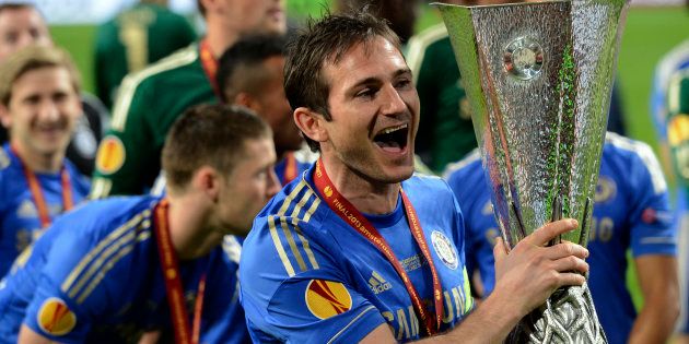 Frank Lampard holds the trophy after defeating Benfica in the Europa League final soccer match at the Amsterdam Arena May 15, 2013.